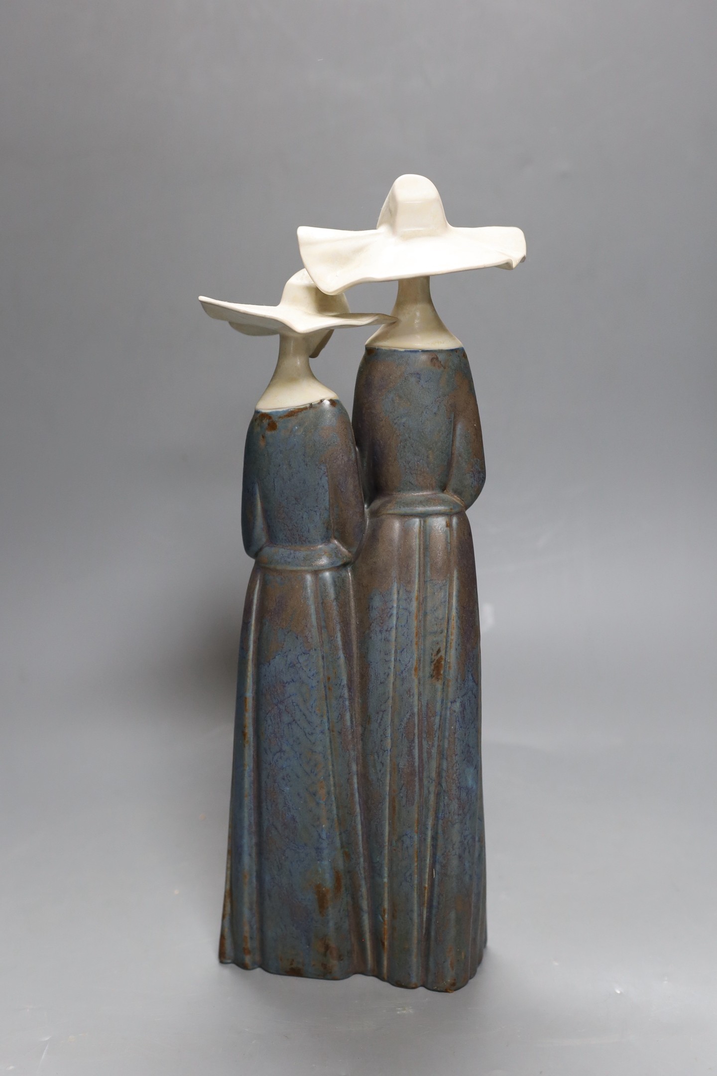 A Lladro stoneware group of two nuns, 34 cm high, boxed